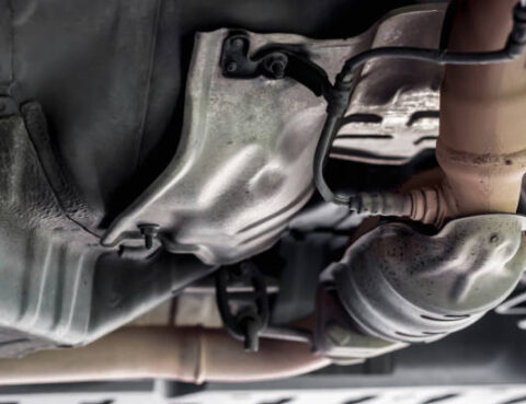 Close up oxygen sensor on Catalyst pipe of gasoline engine car on the hoist lift for service and repair in Garage shop