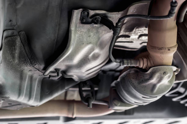 Close up oxygen sensor on Catalyst pipe of gasoline engine car on the hoist lift for service and repair in Garage shop